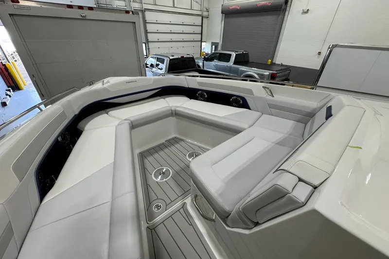 Slide: The Image of 2026 Formula 360 Crossover Bowrider I/O interior with spacious seating in a showroom. - 104