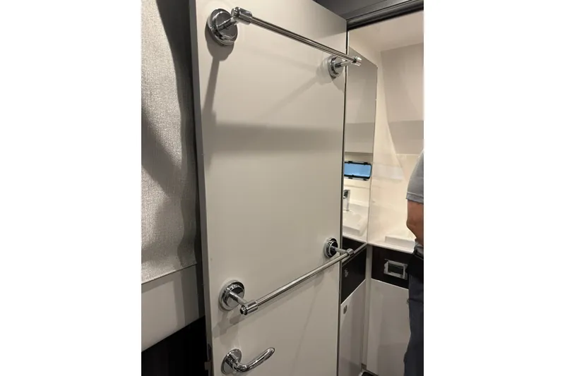 Slide: The Image of Interior of 2026 Formula 360 Crossover Bowrider I/O, featuring sleek bathroom design. - 7