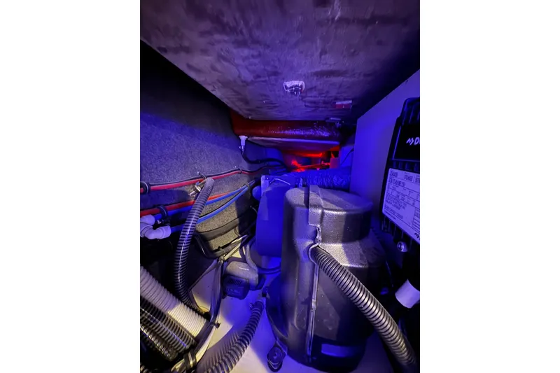 Slide: The Image of Engine compartment of 2026 Formula 360 Crossover Bowrider I/O with visible wiring and components. - 166