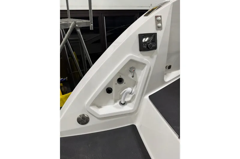 Slide: The Image of 2026 Formula 360 Crossover Bowrider I/O interior detail with control panel and faucet. - 22