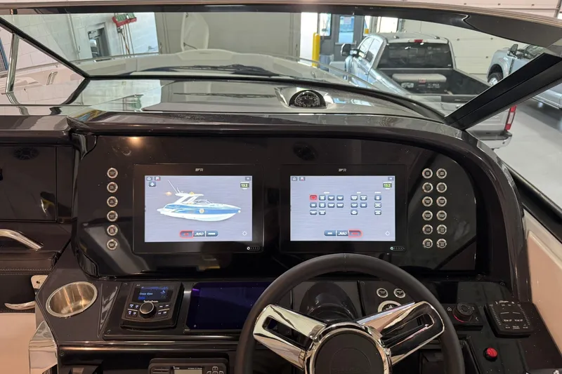 Slide: The Image of Dashboard of 2026 Formula 360 Crossover Bowrider I/O with dual touchscreens and controls. - 77