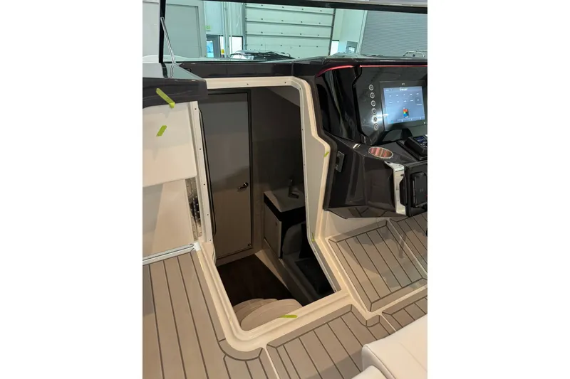 Slide: The Image of Interior view of 2026 Formula 360 Crossover Bowrider I/O with modern dashboard and cabin entrance. - 133