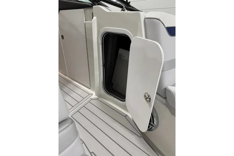 Slide: The Image of Open storage compartment on 2026 Formula 360 Crossover Bowrider I/O boat. - 100