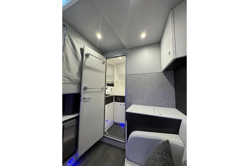 Slide: The Image of Interior of 2026 Formula 360 Crossover Bowrider I/O, featuring modern cabinetry and lighting. - 192