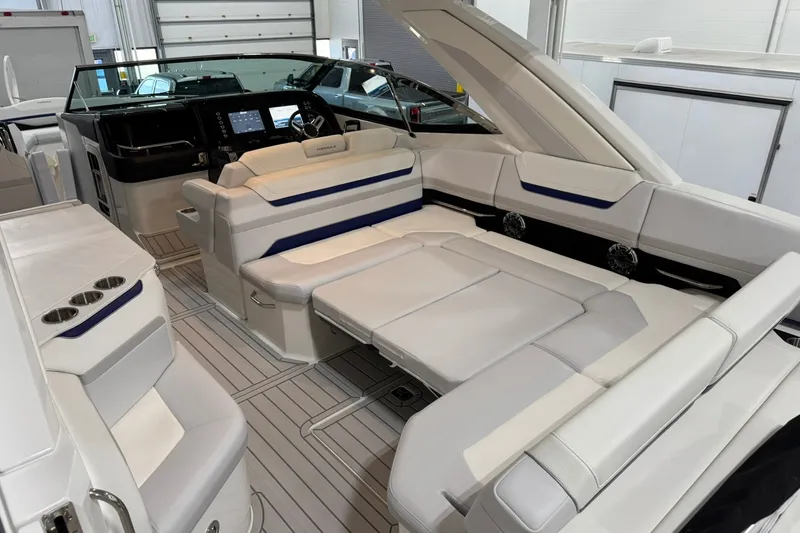 Slide: The Image of 2026 Formula 360 Crossover Bowrider I/O interior with luxurious seating and modern dashboard. - 60