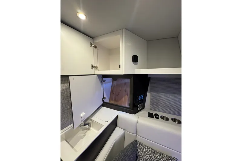 Slide: The Image of Interior of 2026 Formula 360 Crossover Bowrider I/O, featuring modern cabinetry and seating. - 169