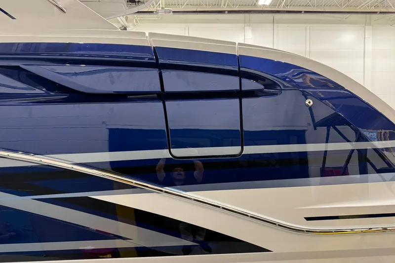 Slide: The Image of 2026 Formula 360 Crossover Bowrider I/O with sleek blue and white exterior design. - 5