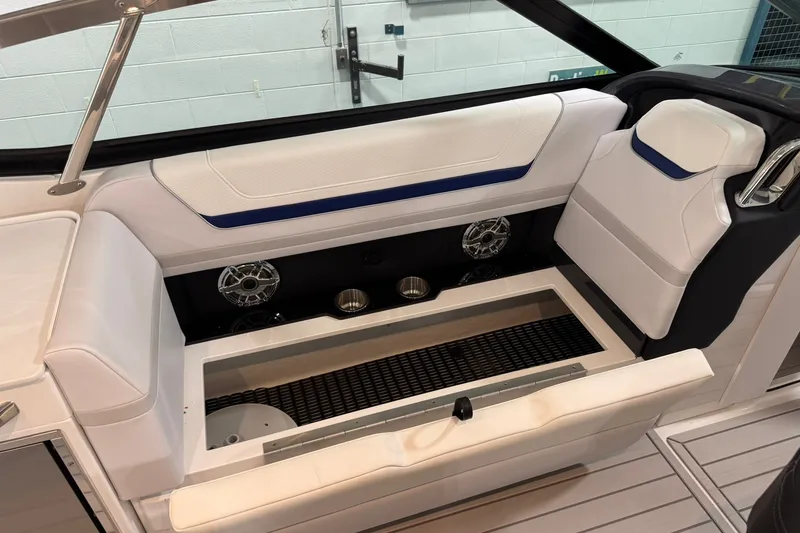 Slide: The Image of 2026 Formula 360 Crossover Bowrider I/O interior seating with storage and cup holders. - 84