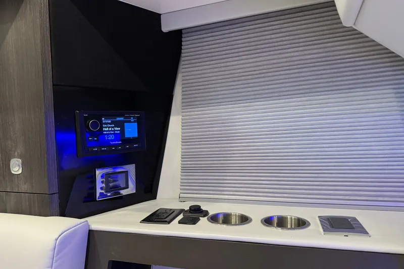 Slide: The Image of Interior of 2026 Formula 360 Crossover Bowrider I/O with modern controls and cup holders. - 158