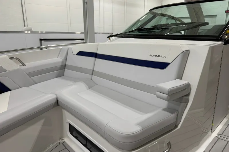 Slide: The Image of 2026 Formula 360 Crossover Bowrider I/O interior seating, featuring sleek white and blue design. - 110