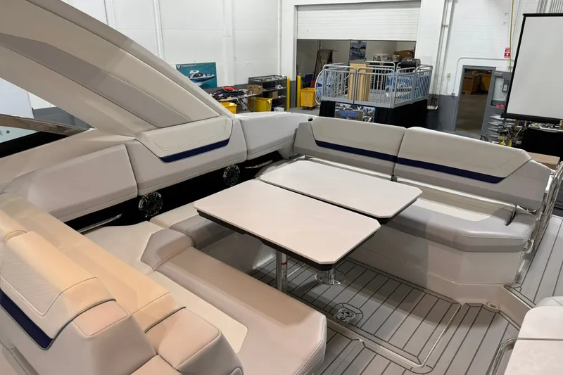 Slide: The Image of 2026 Formula 360 Crossover Bowrider I/O interior with spacious seating and table setup. - 67