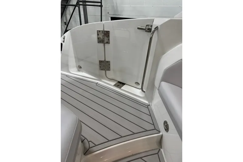 Slide: The Image of 2026 Formula 360 Crossover Bowrider I/O interior with sleek deck and stainless steel fittings. - 26