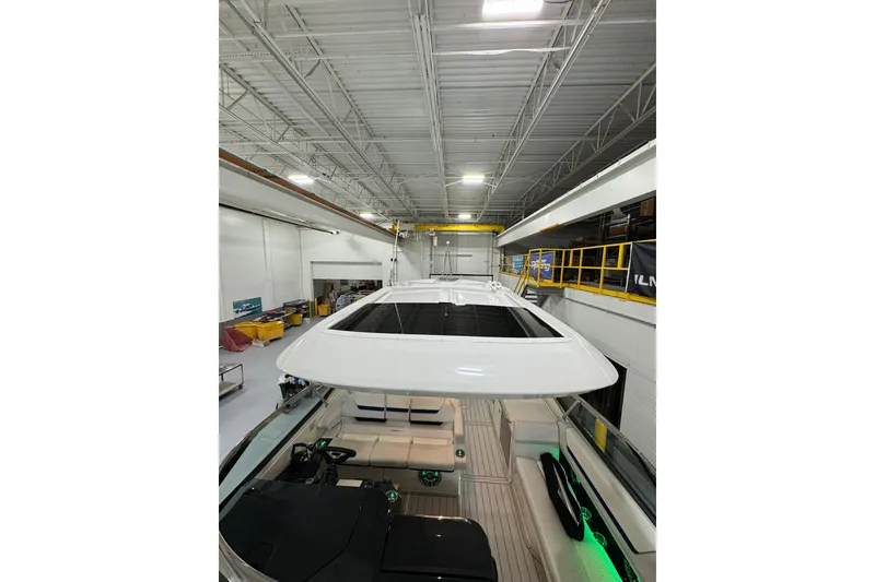 Slide: The Image of 2026 Formula 360 Crossover Bowrider I/O in a spacious indoor facility. - 195