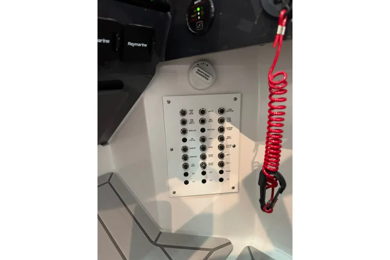 Slide: The Image of Control panel of 2026 Formula 360 Crossover Bowrider I/O with switches and safety lanyard. - 79