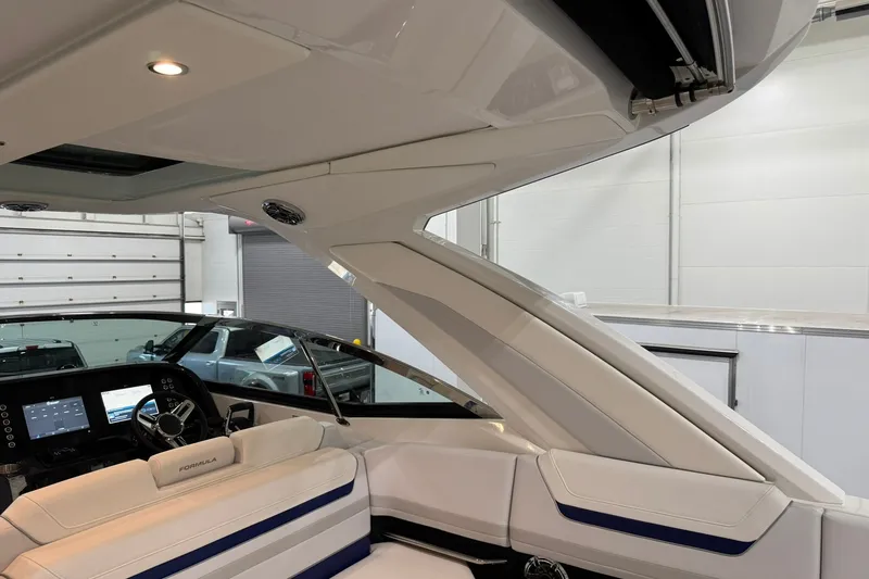 Slide: The Image of Interior view of 2026 Formula 360 Crossover Bowrider I/O, showcasing sleek design and modern dashboard. - 51