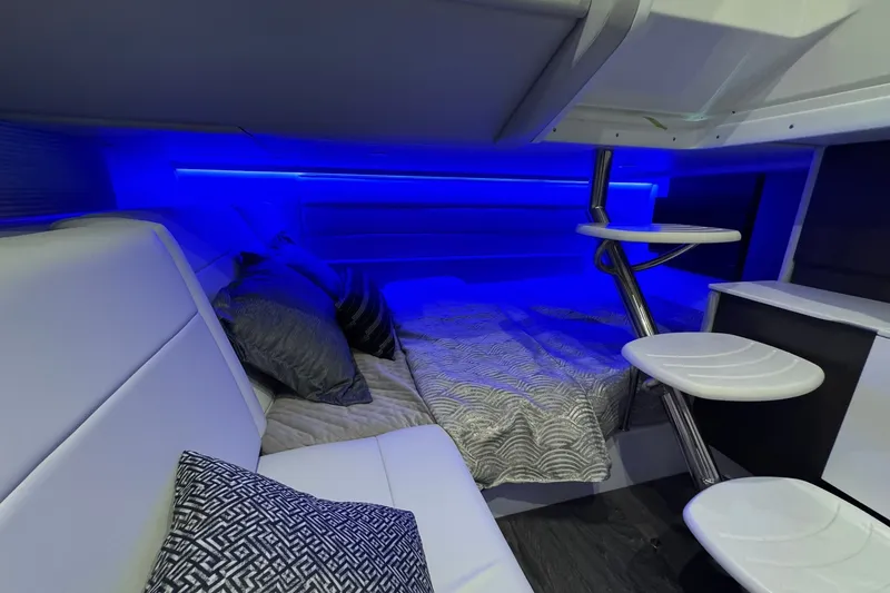 Slide: The Image of Luxurious interior of 2026 Formula 360 Crossover Bowrider I/O with ambient blue lighting. - 151