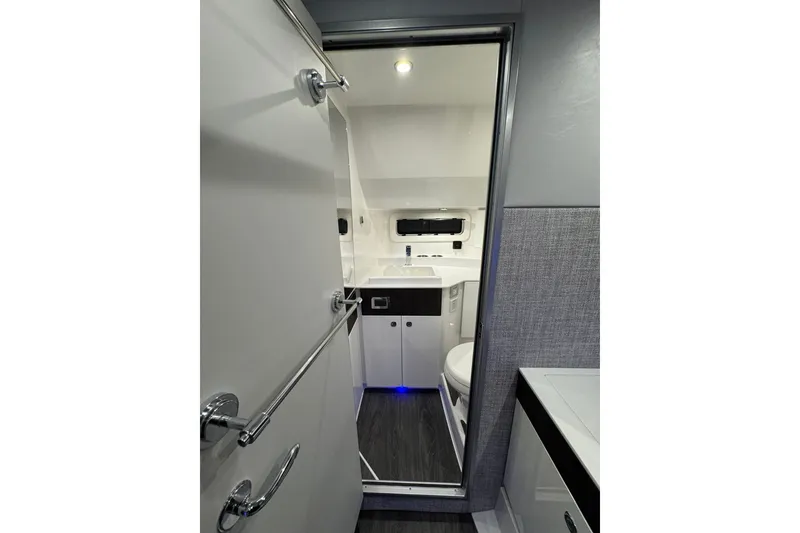 Slide: The Image of Interior of 2026 Formula 360 Crossover Bowrider I/O, featuring modern bathroom amenities. - 180