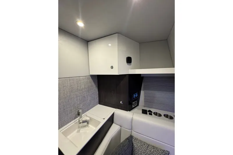 Slide: The Image of Interior of 2026 Formula 360 Crossover Bowrider I/O, featuring modern cabinetry and seating. - 168