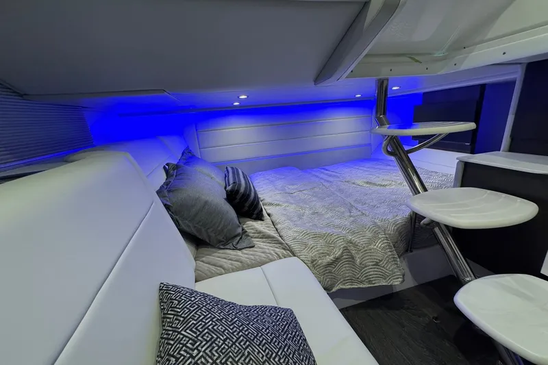 Slide: The Image of Luxurious interior of 2026 Formula 360 Crossover Bowrider I/O with modern bedding and ambient lighting. - 152