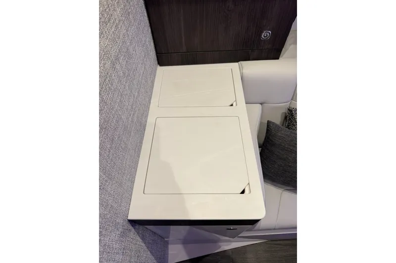 Slide: The Image of Interior seating area of 2026 Formula 360 Crossover Bowrider I/O with storage compartments. - 177