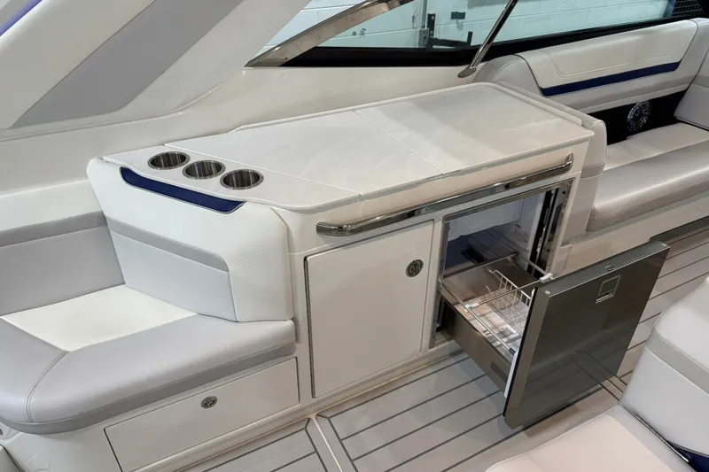 Slide: The Image of Interior of 2026 Formula 360 Crossover Bowrider I/O with open drawer and cup holders. - 38