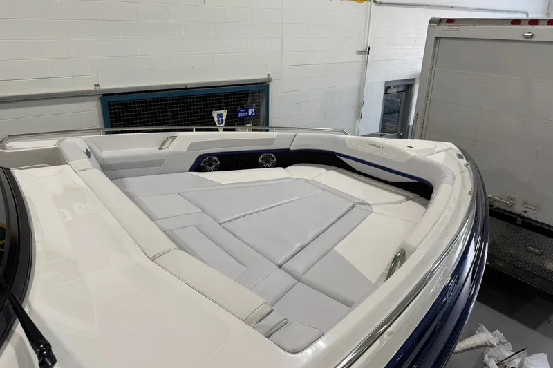 Slide: The Image of 2026 Formula 360 Crossover Bowrider I/O with spacious seating in a garage setting. - 128