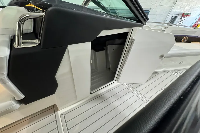 Slide: The Image of 2026 Formula 360 Crossover Bowrider I/O interior with open storage compartment. - 96