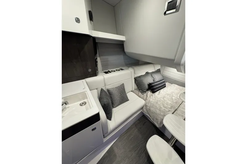 Slide: The Image of Luxurious interior of 2026 Formula 360 Crossover Bowrider I/O with modern seating and bedding. - 137