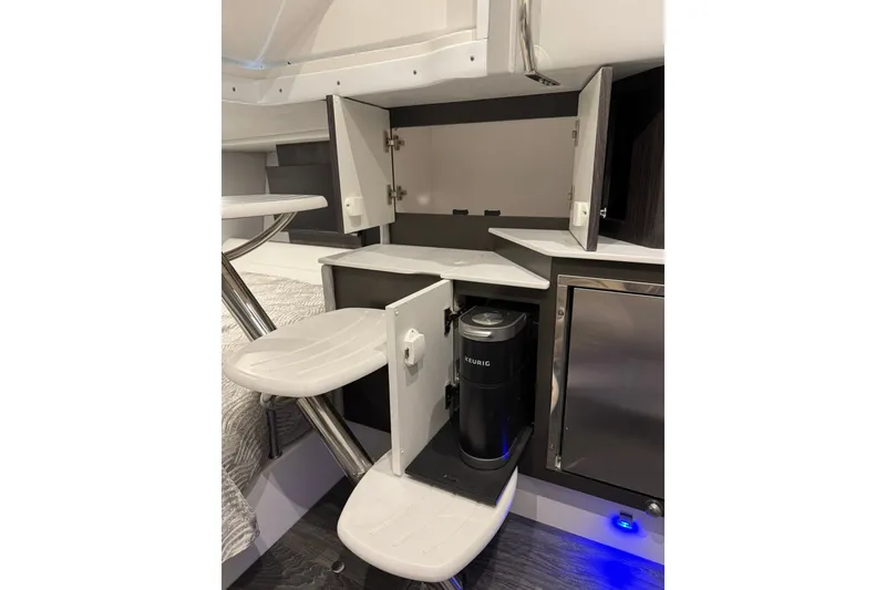 Slide: The Image of Interior of 2026 Formula 360 Crossover Bowrider I/O with Keurig coffee maker and storage cabinets. - 146