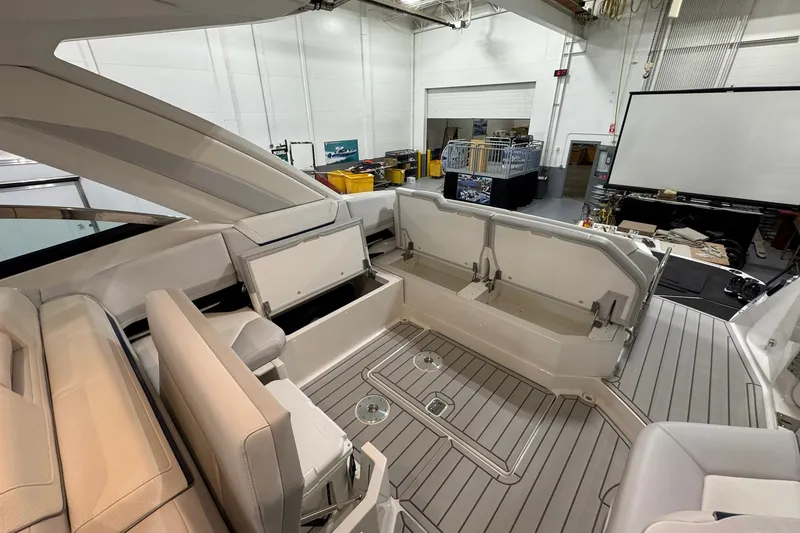 Slide: The Image of Interior view of 2026 Formula 360 Crossover Bowrider I/O, showcasing spacious seating and storage. - 54