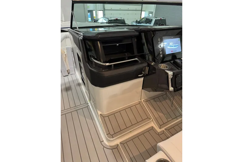Slide: The Image of 2026 Formula 360 Crossover Bowrider I/O cockpit with modern controls and sleek design. - 80