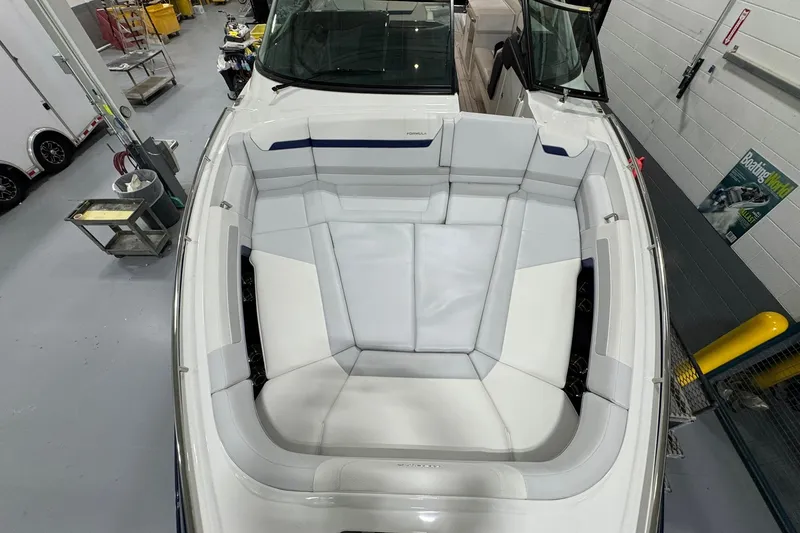 Slide: The Image of 2026 Formula 360 Crossover Bowrider I/O with spacious seating in a workshop setting. - 124