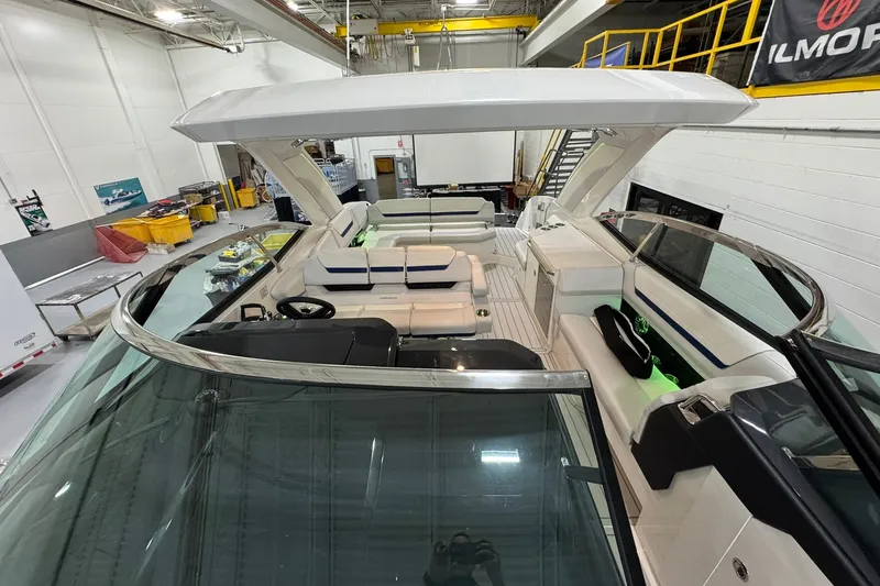 Slide: The Image of 2026 Formula 360 Crossover Bowrider I/O in a showroom, showcasing luxury seating and design. - 196