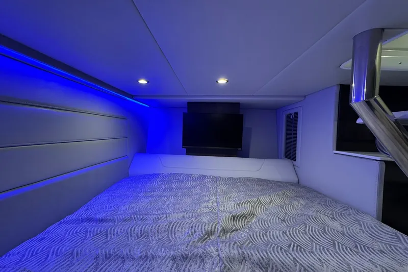 Slide: The Image of Interior cabin of 2026 Formula 360 Crossover Bowrider I/O with ambient blue lighting. - 162