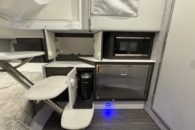 Slide: The Image of Interior of 2026 Formula 360 Crossover Bowrider I/O with microwave and Keurig coffee maker. - 147