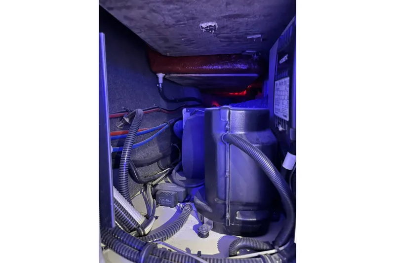 Slide: The Image of Engine compartment of 2026 Formula 360 Crossover Bowrider I/O with visible wiring and components. - 164