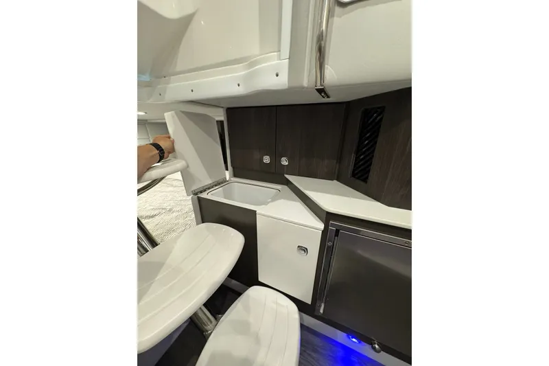 Slide: The Image of Interior of 2026 Formula 360 Crossover Bowrider I/O, featuring sleek cabinetry and seating. - 148