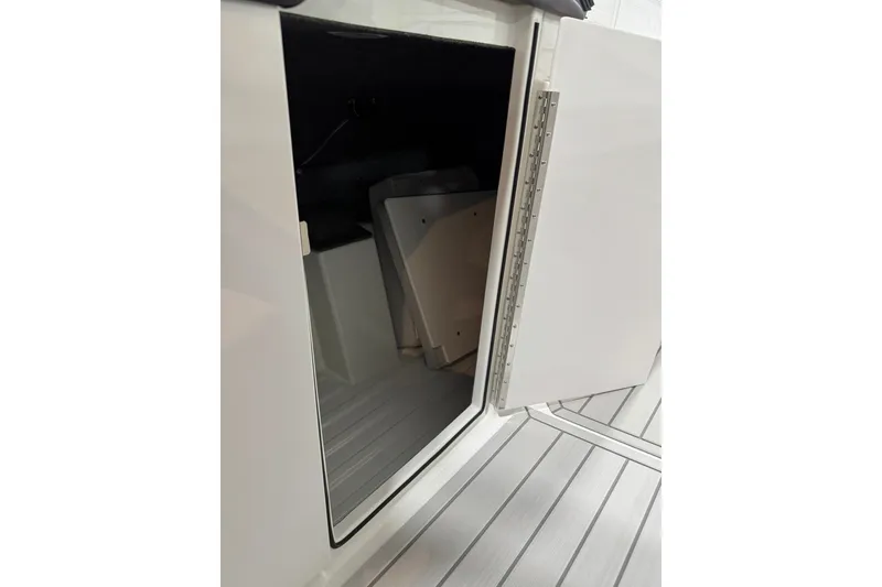 Slide: The Image of Open storage compartment on 2026 Formula 360 Crossover Bowrider I/O boat. - 94