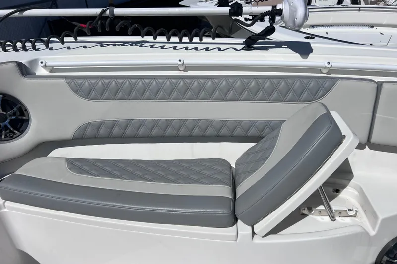 Slide: The Image of 2022 Sea Pro 320 DLX Offshore boat with gray diamond-stitched seating. - 68