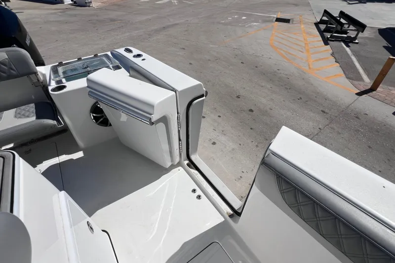Slide: The Image of 2022 Sea Pro 320 DLX Offshore boat interior with seating and storage compartments. - 45
