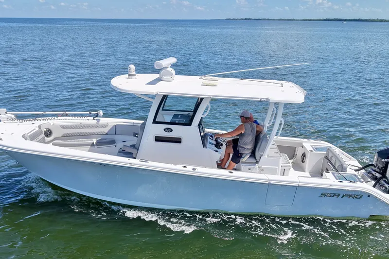 The Image of 2022 Sea Pro 320 DLX Offshore boat cruising on open water. - 4