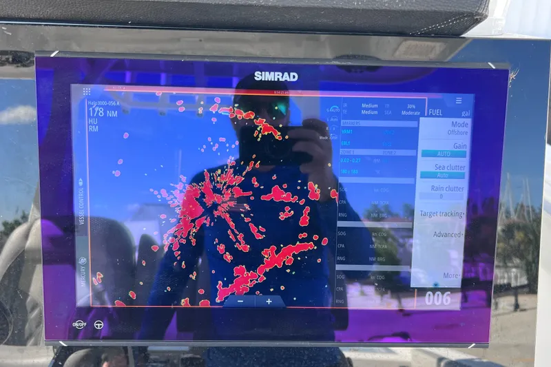 Slide: The Image of Simrad marine display on 2022 Sea Pro 320 DLX Offshore boat, showing radar data. - 61