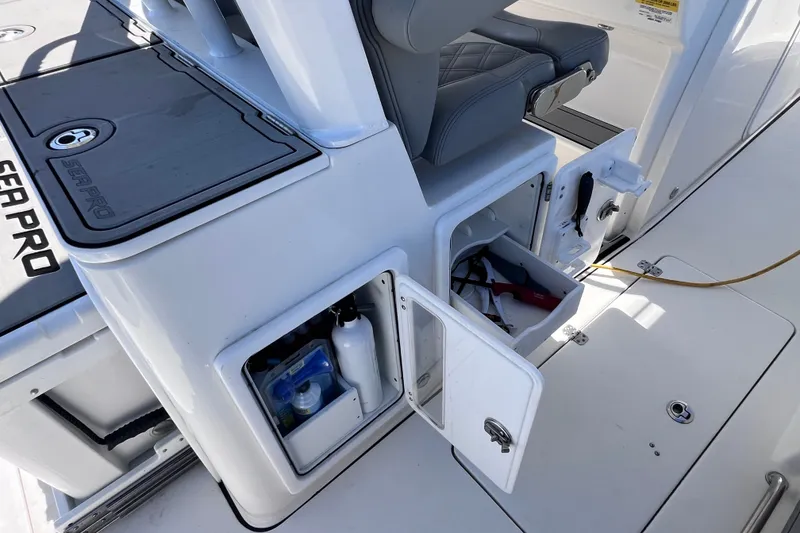 Slide: The Image of 2022 Sea Pro 320 DLX Offshore boat interior with storage compartments open. - 42