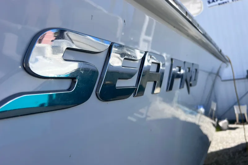 Slide: The Image of Close-up of 2022 Sea Pro 320 DLX Offshore boat logo on hull. - 18