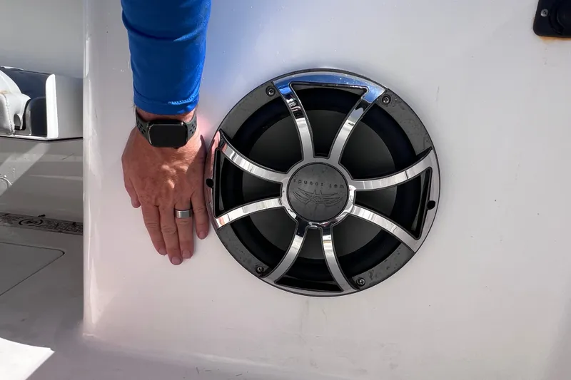 Slide: The Image of Hand touching speaker on 2022 Sea Pro 320 DLX Offshore boat. - 35