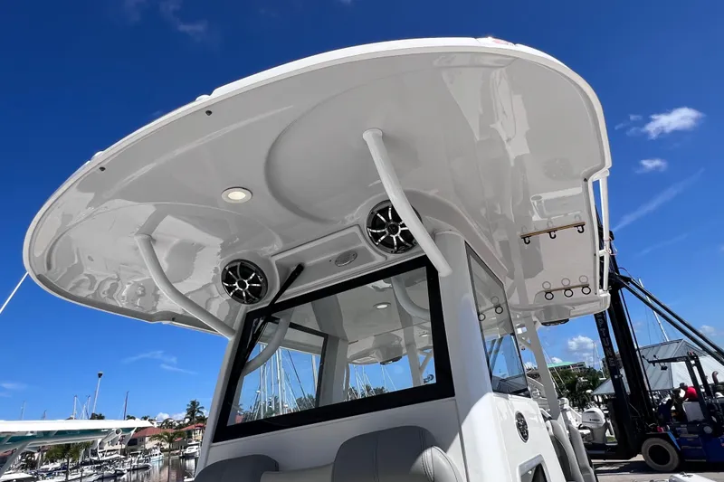 Slide: The Image of 2022 Sea Pro 320 DLX Offshore boat with sleek design and modern features at a marina. - 77