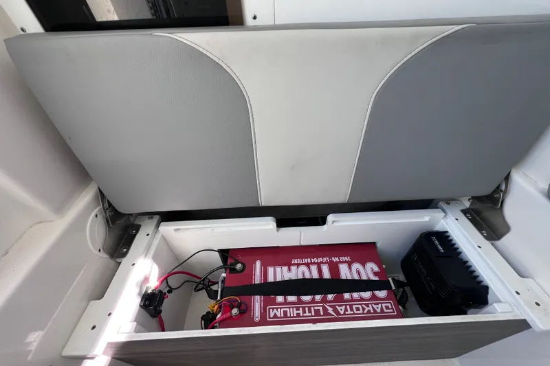 Slide: The Image of Storage compartment in a 2022 Sea Pro 320 DLX Offshore boat with lithium battery. - 89