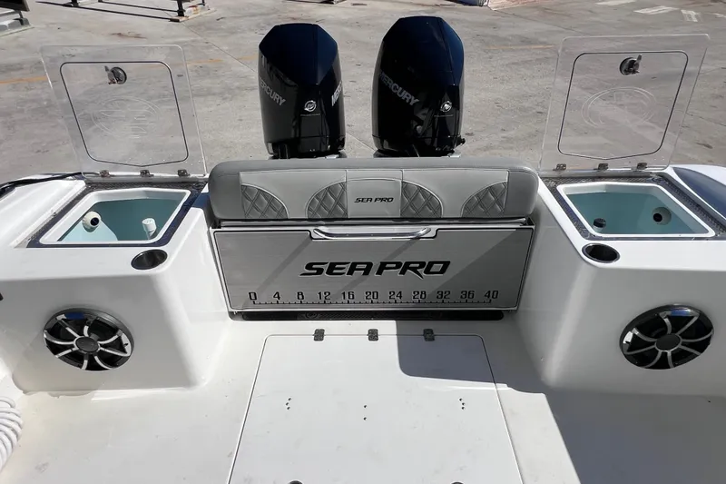 Slide: The Image of 2022 Sea Pro 320 DLX Offshore boat with dual Mercury engines and live wells. - 33