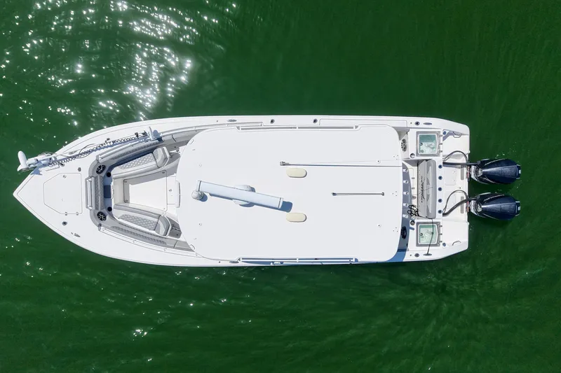 Slide: The Image of Aerial view of 2022 Sea Pro 320 DLX Offshore boat on green water. - 13