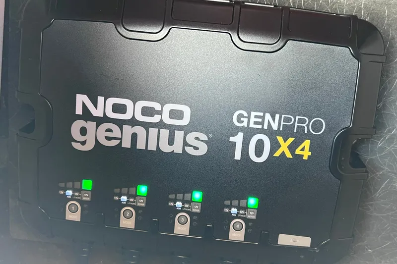 Slide: The Image of NOCO Genius GENPRO 10X4 battery charger on 2022 Sea Pro 320 DLX Offshore boat. - 94